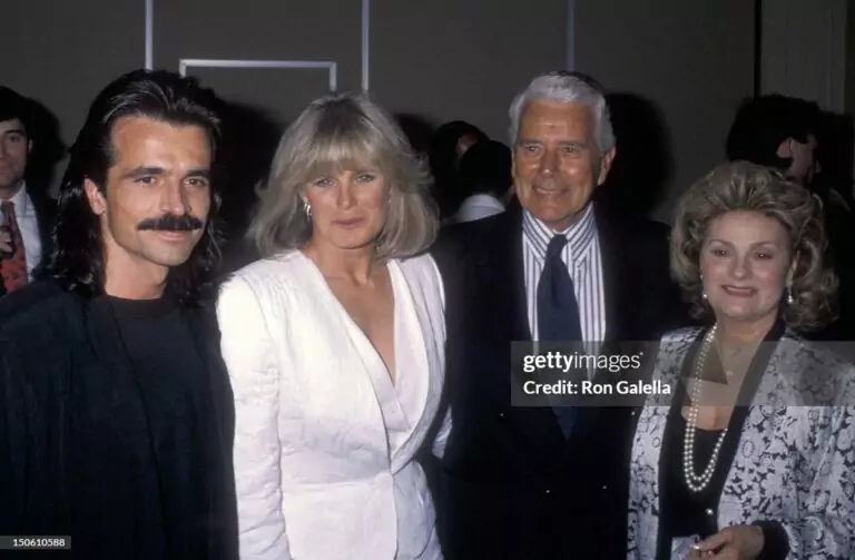 BEVERLY HILLS, CA - MAY 31:   Musician Yanni, actress Linda Evans, actor John Forsythe and wife Julie Warren attend the Party to Celebrate Yanni's New Album "Reflections of Passion" on May 31, 1990 at the Beverly Hills Hotel in Beverly Hills, California. (Photo by Ron Galella, Ltd./Ron Galella Collection via Getty Images)