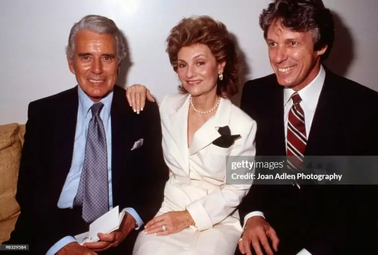 LOS ANGELES - SEPTEMBER 19:  Actor John Forsythe and his wife Julie sit with designer Nolan Miller at a private showing of "The Dynasty Collection" on  Sept 19, 1987 in Los Angeles, California.  The showing is to showcase some of the costumes designed by Nolan Miller, that appear on the series.  (Photo by Joan Adlen/Getty Images)