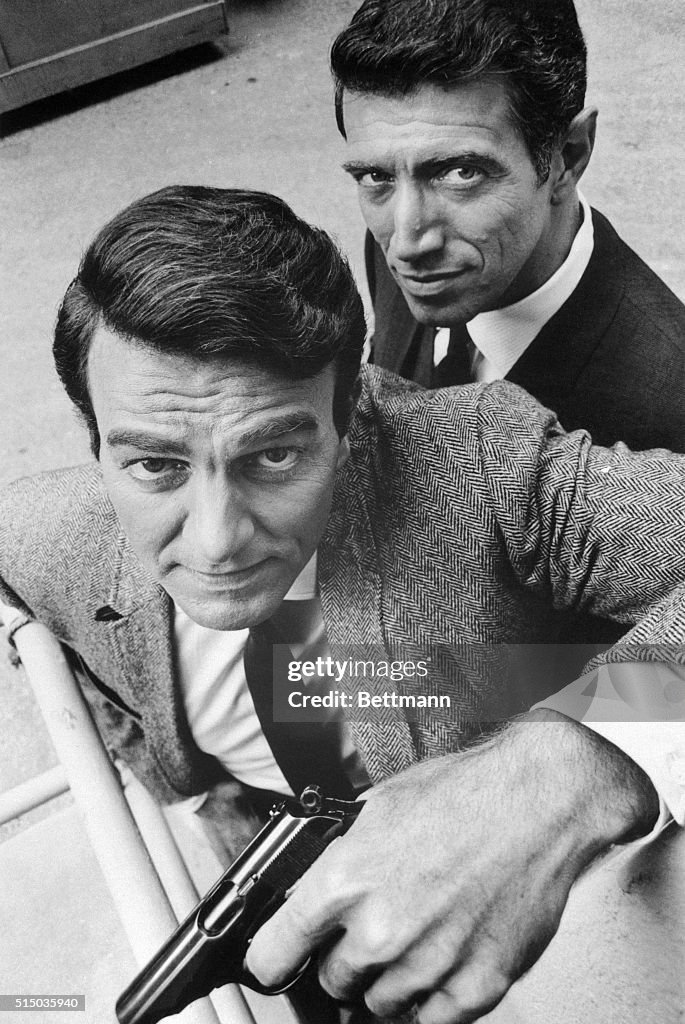(Original Caption) Mike Connors (with gun) and Joe Campanella in scenes from the TV series: Mannix September, 1967.