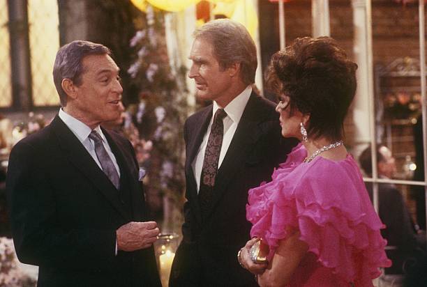 DYNASTY - "The Garage" - Airdate March 11, 1987. (Photo by ABC Photo Archives/Disney General Entertainment Content via Getty Images) PAUL BURKE;JOHN CYPHER;JOAN COLLINS