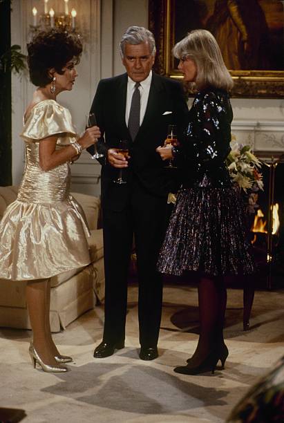 DYNASTY - "The Aftermath" - Airdate October 7, 1987. (Photo by ABC Photo Archives/Disney General Entertainment Content via Getty Images) JOAN COLLINS;JOHN FORSYTHE;LINDA EVANS