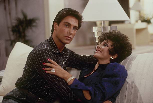 DYNASTY - "The Announcement" - Airdate October 14, 1987. (Photo by ABC Photo Archives/Disney General Entertainment Content via Getty Images) JAMES HEALEY;JOAN COLLINS