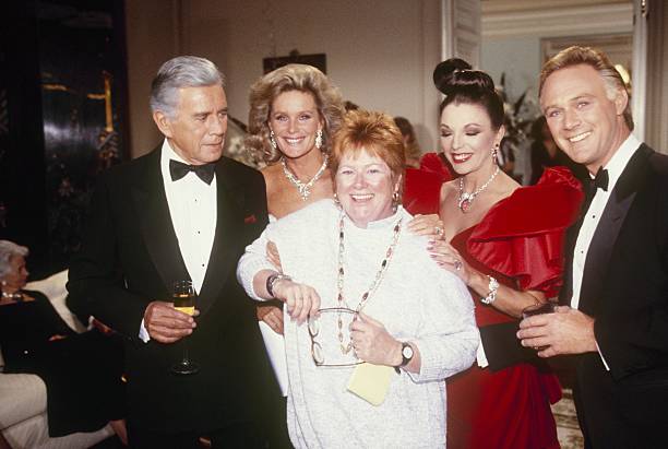 DYNASTY - "The Ball" - Airdate December 17, 1986. (Photo by ABC Photo Archives/Disney General Entertainment Content via Getty Images) JOHN FORSYTHE;LINDA EVANS;NANCY MALONE;JOAN COLLINS;CHRISTOPHER CAZENOVE
