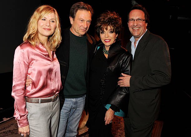 LONDON, ENGLAND - APRIL 12:  (EMBARGOED FOR PUBLICATION IN UK TABLOID NEWSPAPERS UNTIL 48 HOURS AFTER CREATE DATE AND TIME. MANDATORY CREDIT PHOTO BY DAVE M. BENETT/GETTY IMAGES REQUIRED)  (L to R) Glynis Barber, Michael Brandon, Joan Collins and Percy Gibson pose backstage following the opening night performance of her one woman show 'Joan Collins: One Night With Joan' at the Leicester Square Theatre on April 12, 2013 in London, England.  (Photo by Dave M. Benett/Getty Images)