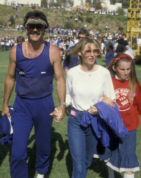 Actor Geoffrey Scott and wife attend the taping of The Battle Of The Network Stars on April 23, 1983 at Pepperdine University in Malibu, California. (Photo by Ron Galella, Ltd./Ron Galella Collection via Getty Images)