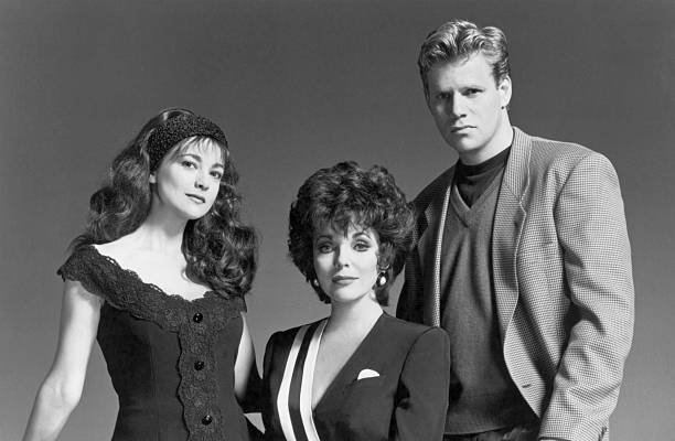 (Original Caption) Joan Collins (center) stars as Alexis Colby, and Emma Samms and Al Corley as her children, in Dynasty: The Reunion, a new, four-hour television event airing as an ABC miniseries, Sunday, October 20, and Tuesday, October 22 (9:00-11:00 p.m., ET, both nights), on the ABC Television Network.