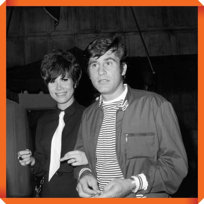 circa 1965: Married American actors James Farentino and Michele Lee walking arm-in-arm at the Daisy Club. Lee has Beatles haircut and wears a dark shirt with a white tie. (Photo by Hulton Archive/Getty Images)